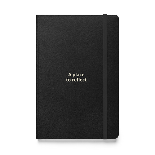 Supplier-generated mockup of the saved A Place to Reflect design: black hardcover journal with two lines of warm cream lettering, an elastic closure, and no additional gifts.